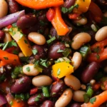 Dense bean salad with mixed vegetables in a bowl