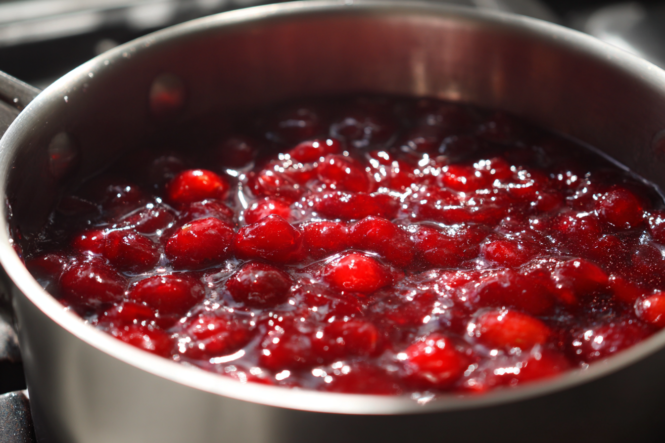 cranberry honey glaze simmering in saucepan