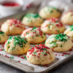 Soft Cream Cheese Christmas Cookies topped with red and green sprinkles a