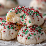 Soft Christmas confetti cream cheese meltaway cookies on a white plate.